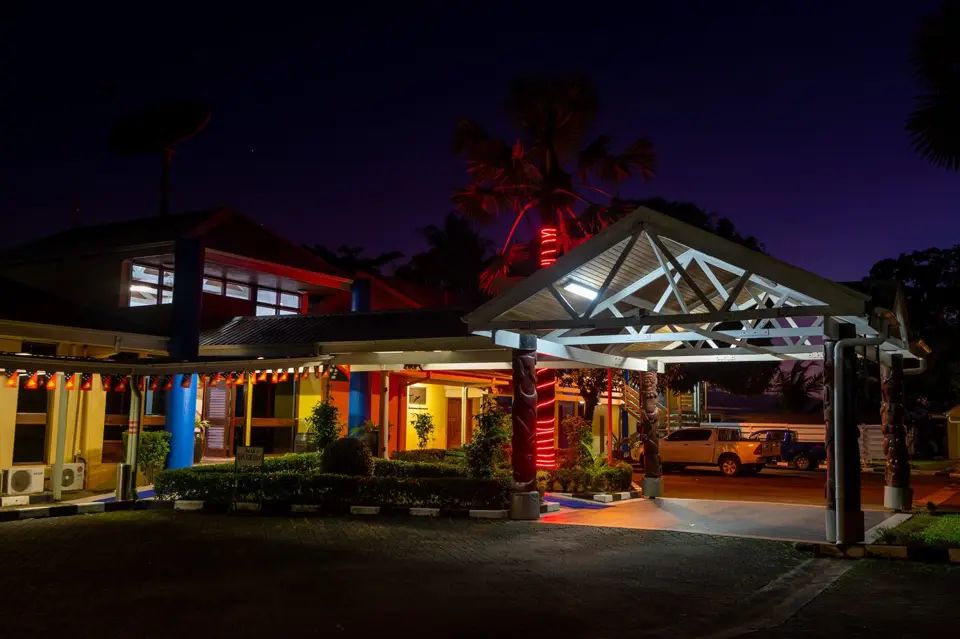 Entrance to Alotau International Hotel at night