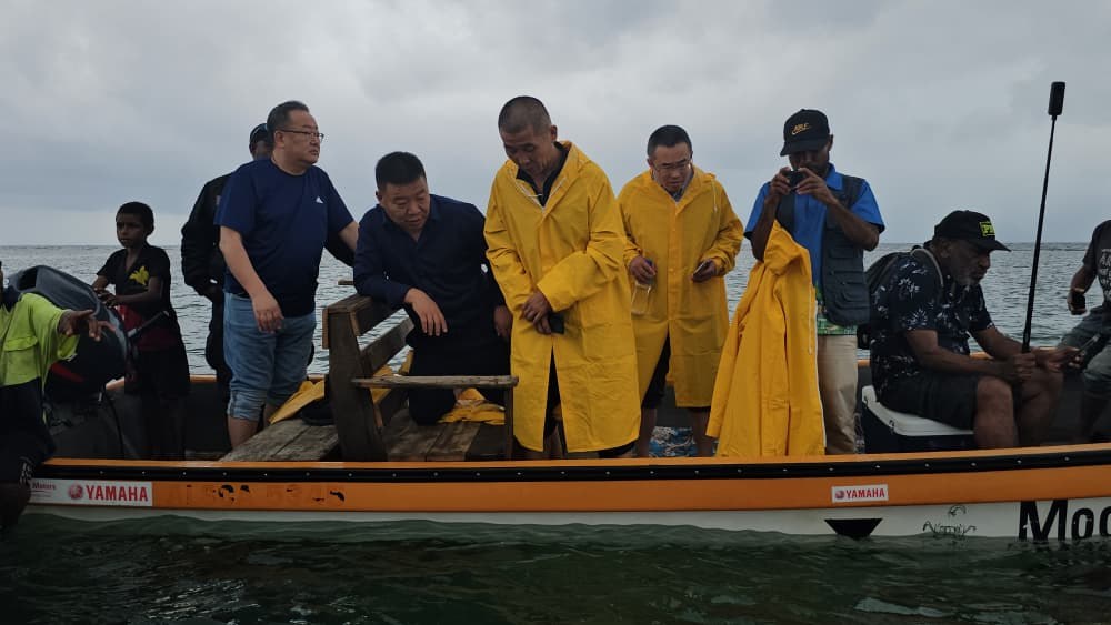 The visiting seaweed team aboard a boat during its Netuli Island inspection, September 2025.