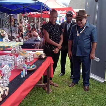 Milne Bay Organics products on display at an outdoor market stall
