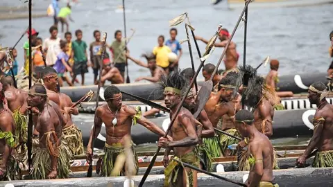 Traditional canoe crews taking part in the Kenu and Kundu Festival