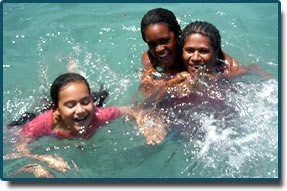 Visitors swimming in a Doini Island rock pool, as pictured by the resort.
